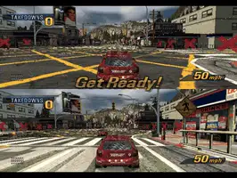 Two-player split-screen race, both cars off the line